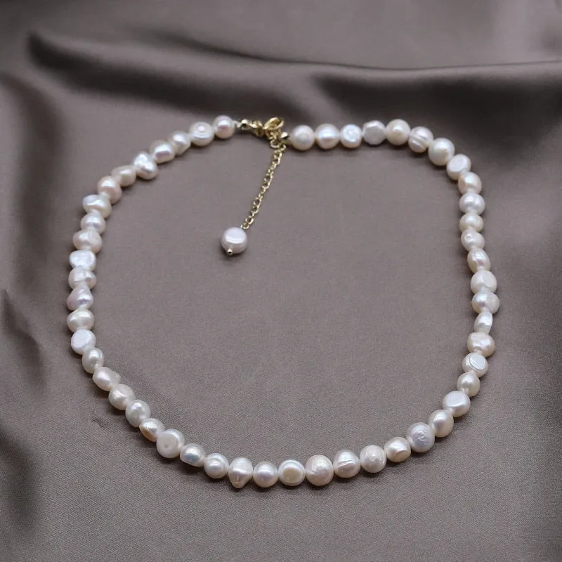 Elegant Freshwater Pearl Charm Bracelet with Copper Details